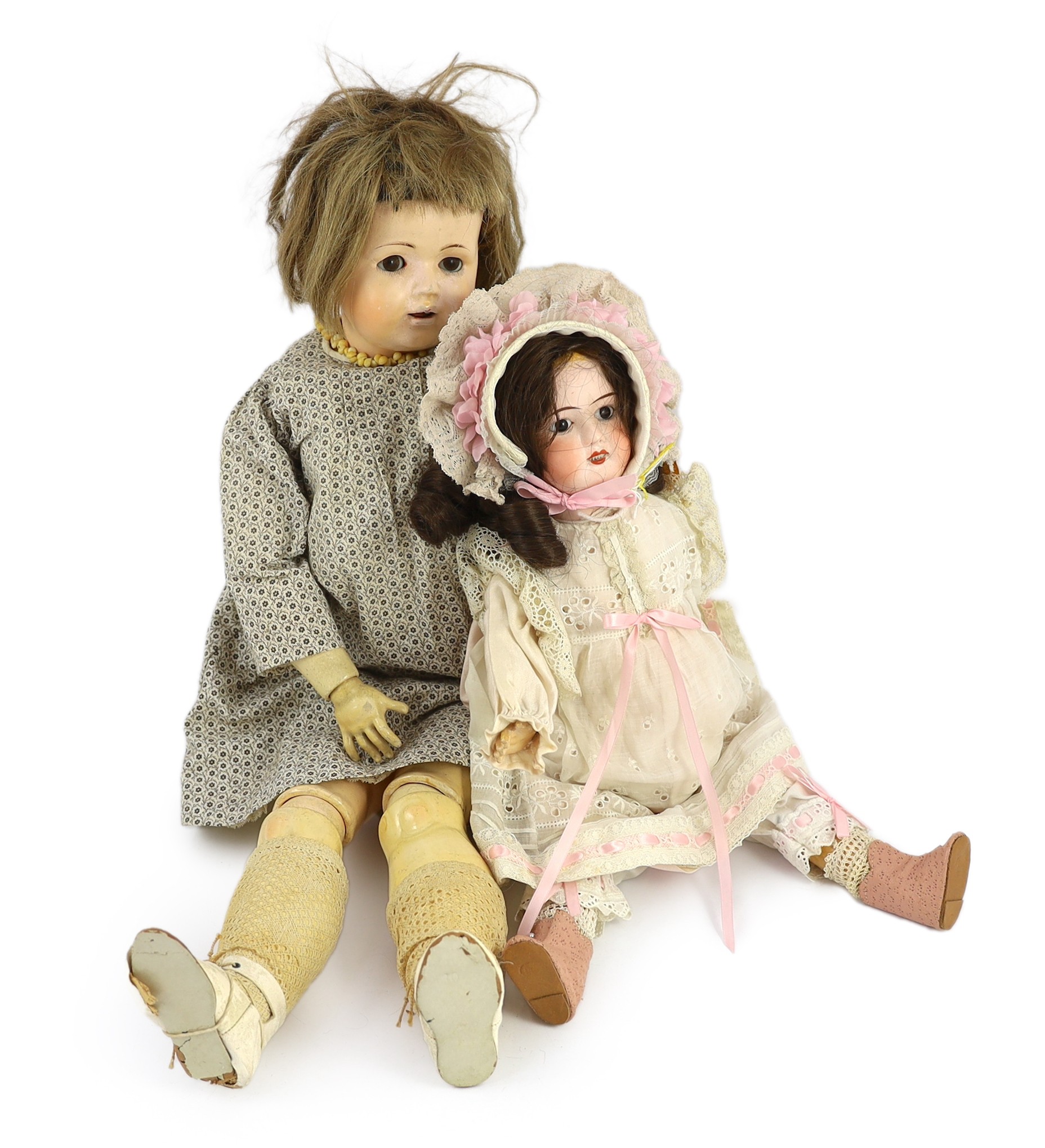 An unusual composition headed doll, German, circa 1900, 19in. (2)